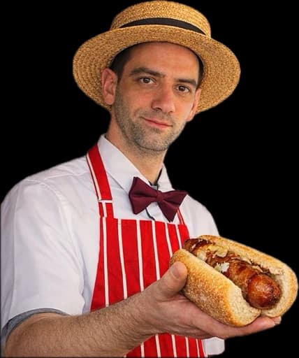 Joseph holding a Cambridge hot dog